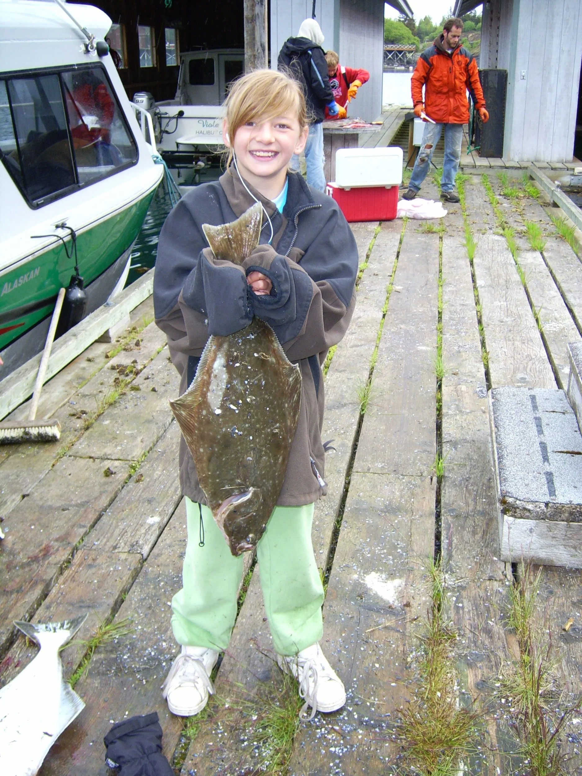 girl holding a fish